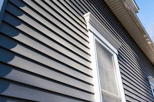 Close up of gray vinyl siding on a residential home